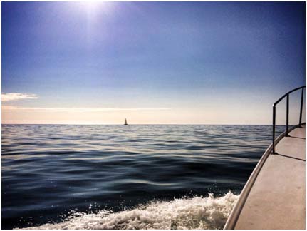 Dive boat on horizon