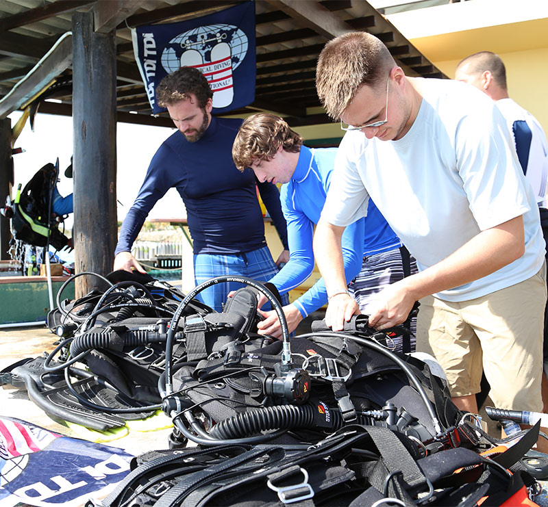 Divers preparing equipment