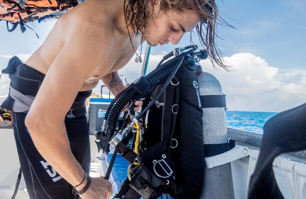 man setting up scuba gear